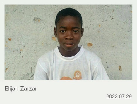 Elijah Zarzar in a white shirt